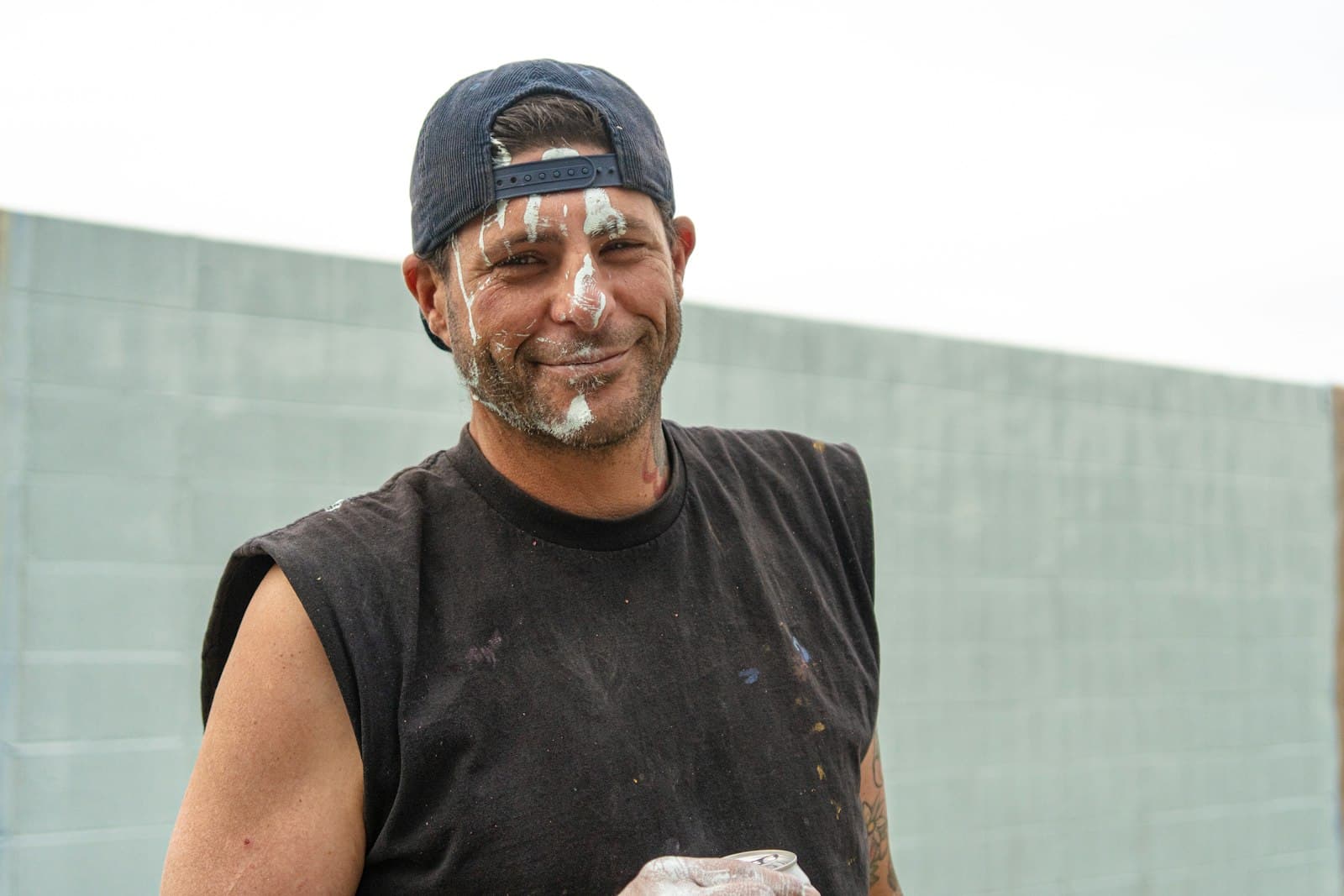 A smiling painter on the job